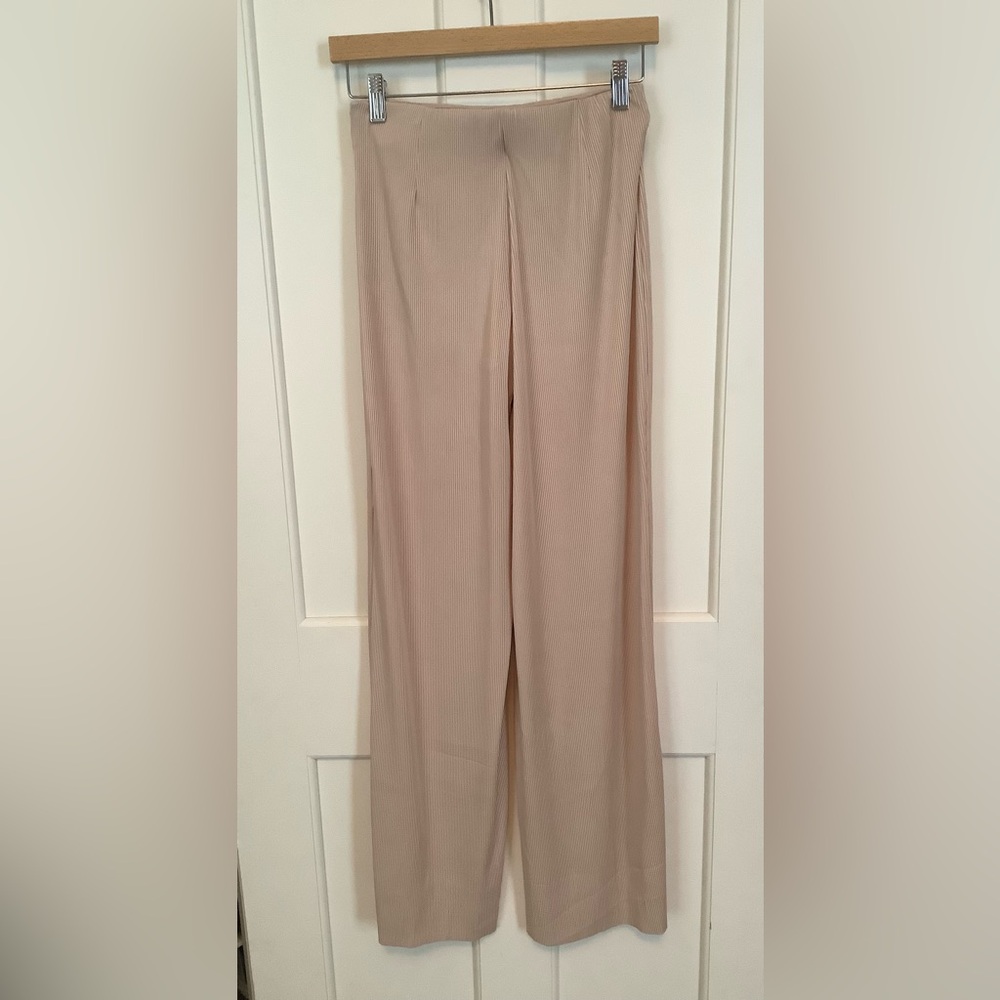 Mango Wide-Leg Ribbed Pants in light tan or beige color.